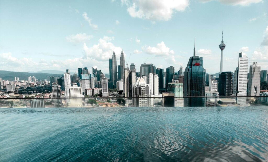 body of water near city buildings during daytime